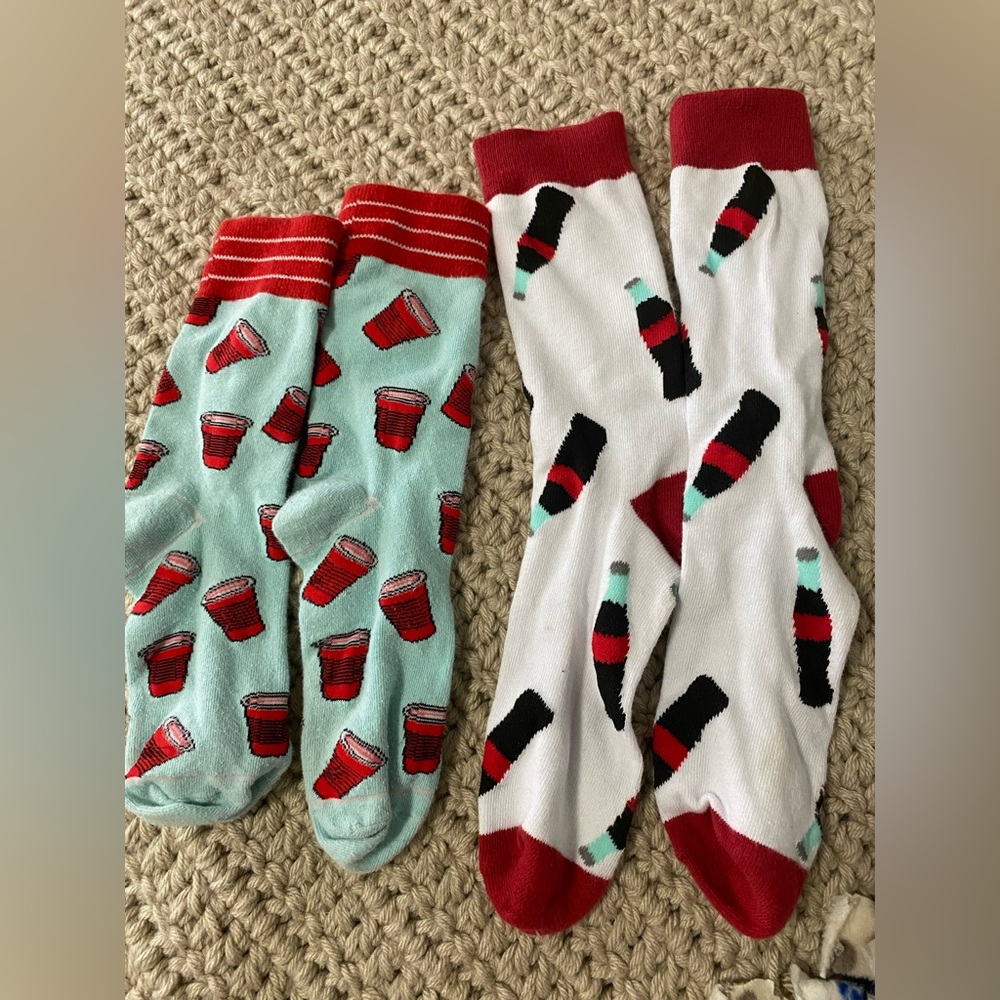 Two pairs of socks! Red solo cups light blue background and cola glasses!